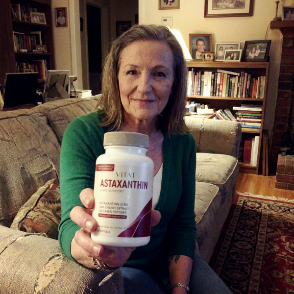 VITA1 community member holding their bottle